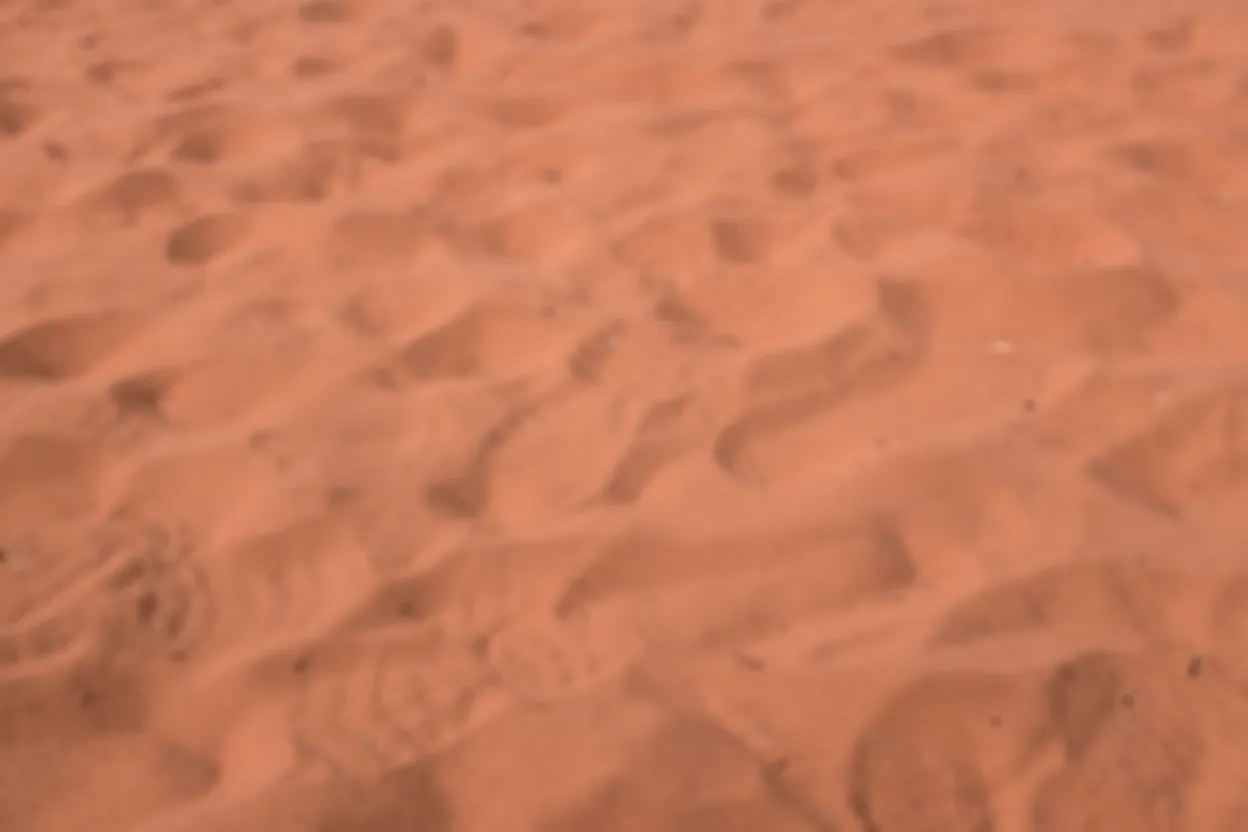 Footprints on Australian red soil, symbolising founder business journeys.