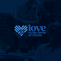 Logo with stylized hands forming a heart next to the text 'love in the name of Christ' over a blurred background of people.