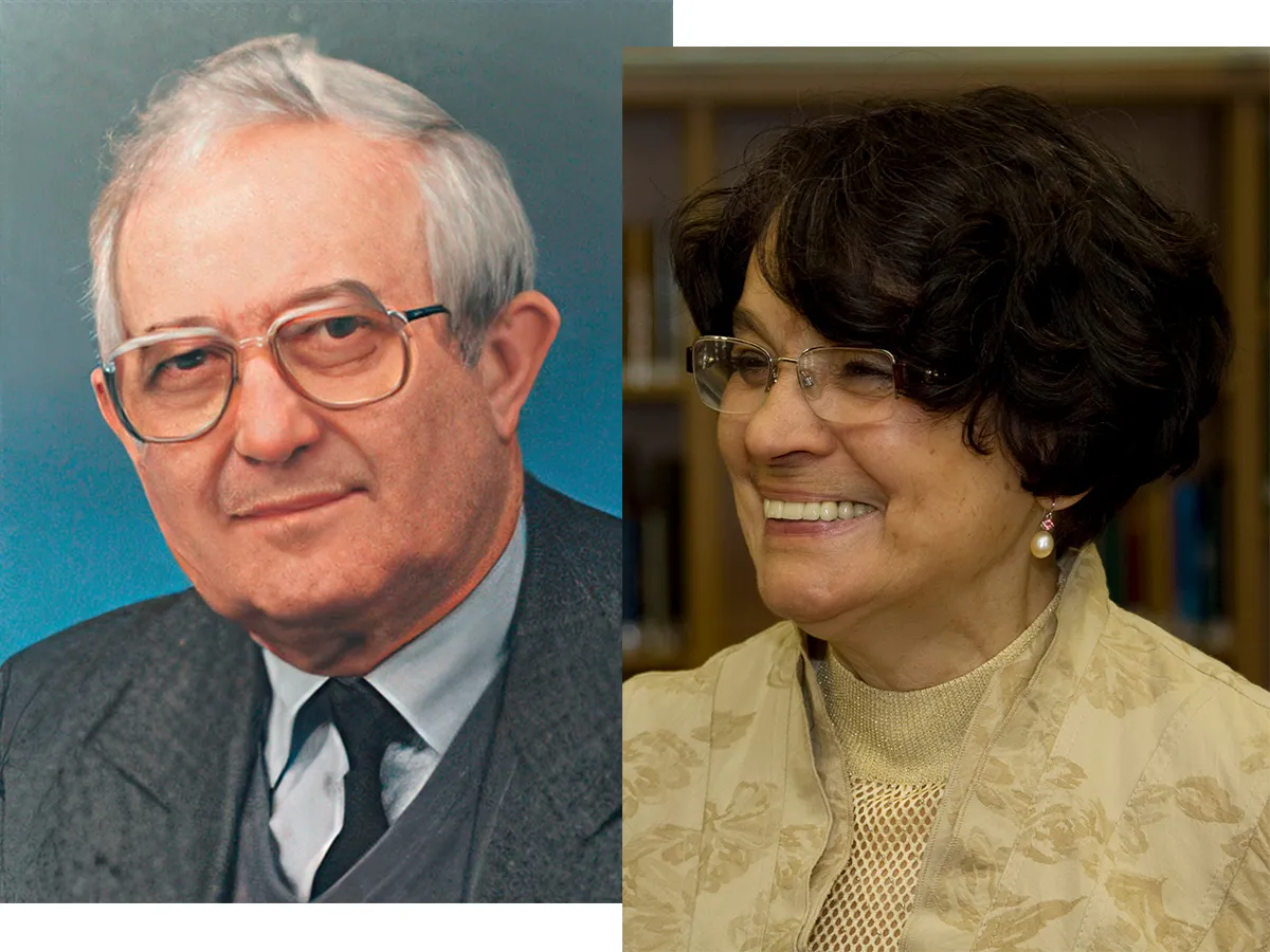Portrait of an elderly man wearing glasses and a gray suit next to a smiling elderly woman with black curly hair, glasses and beige-gold clothing.
