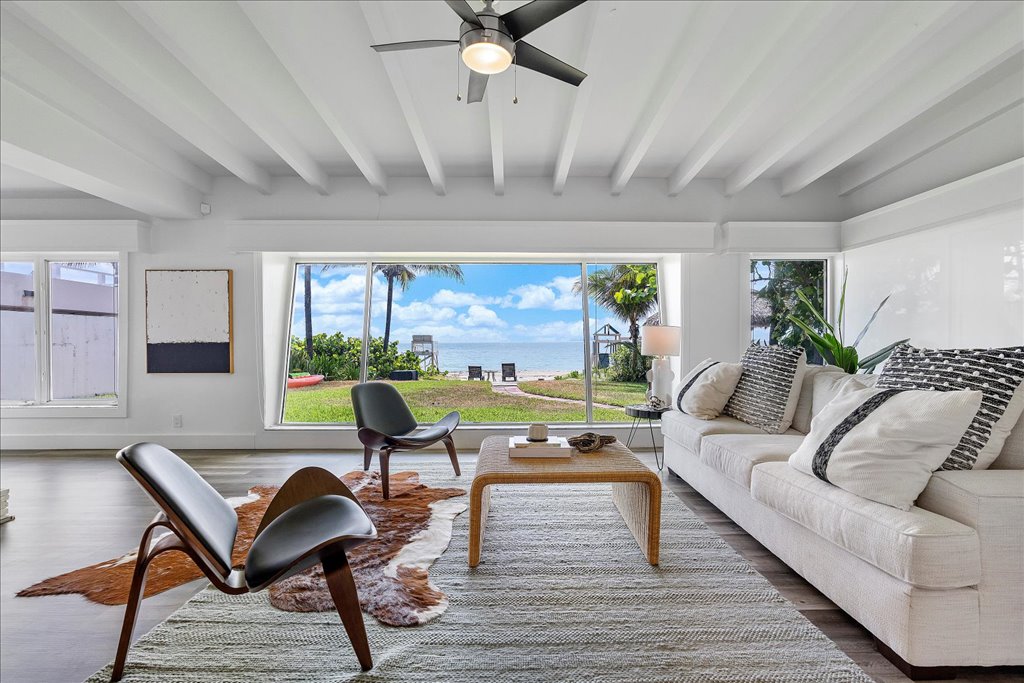 Bright living room with water views in a South Florida home