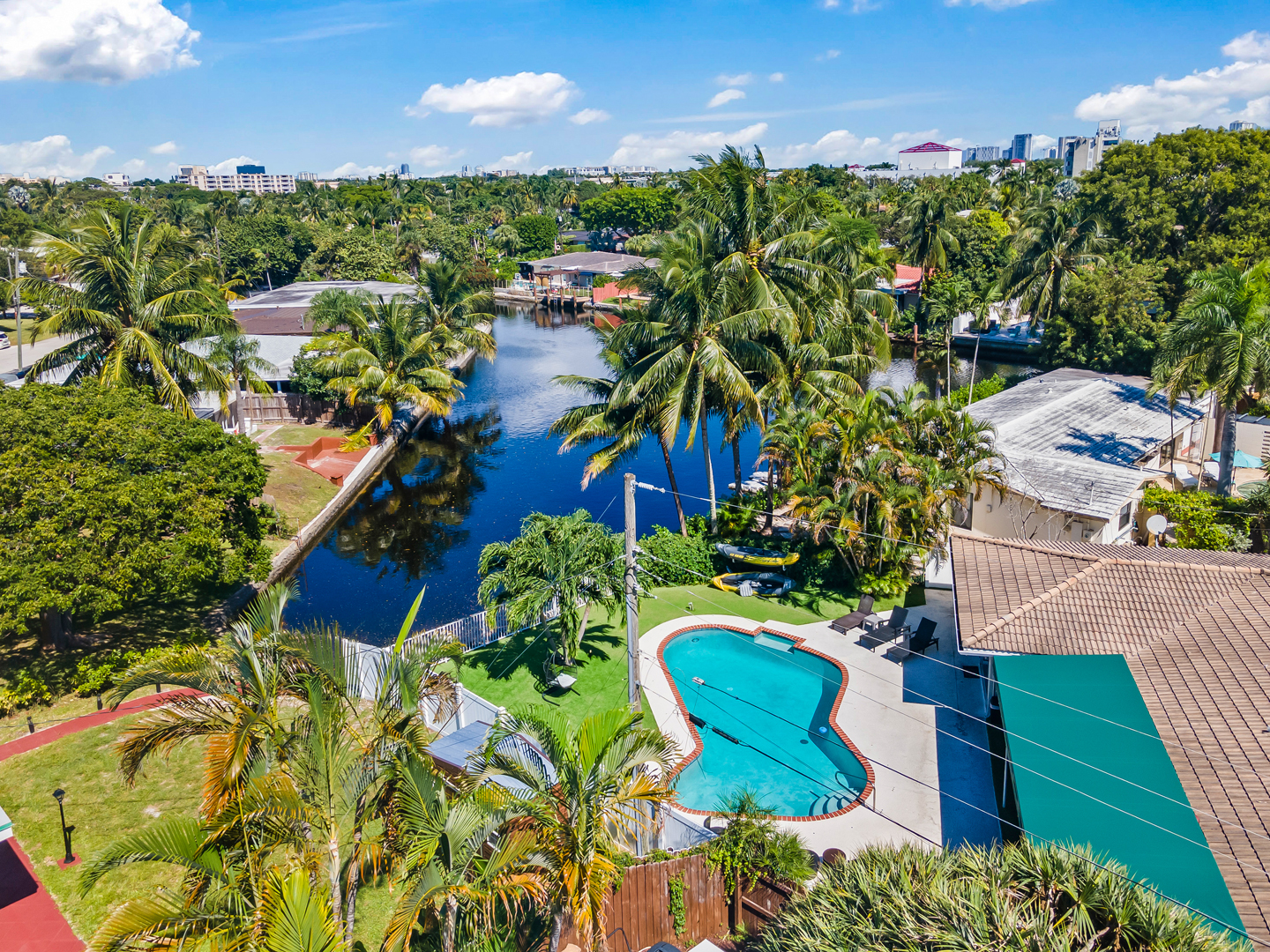 Outdoor pool and lounge area at a South Florida vacation rental managed by Flight Mode
