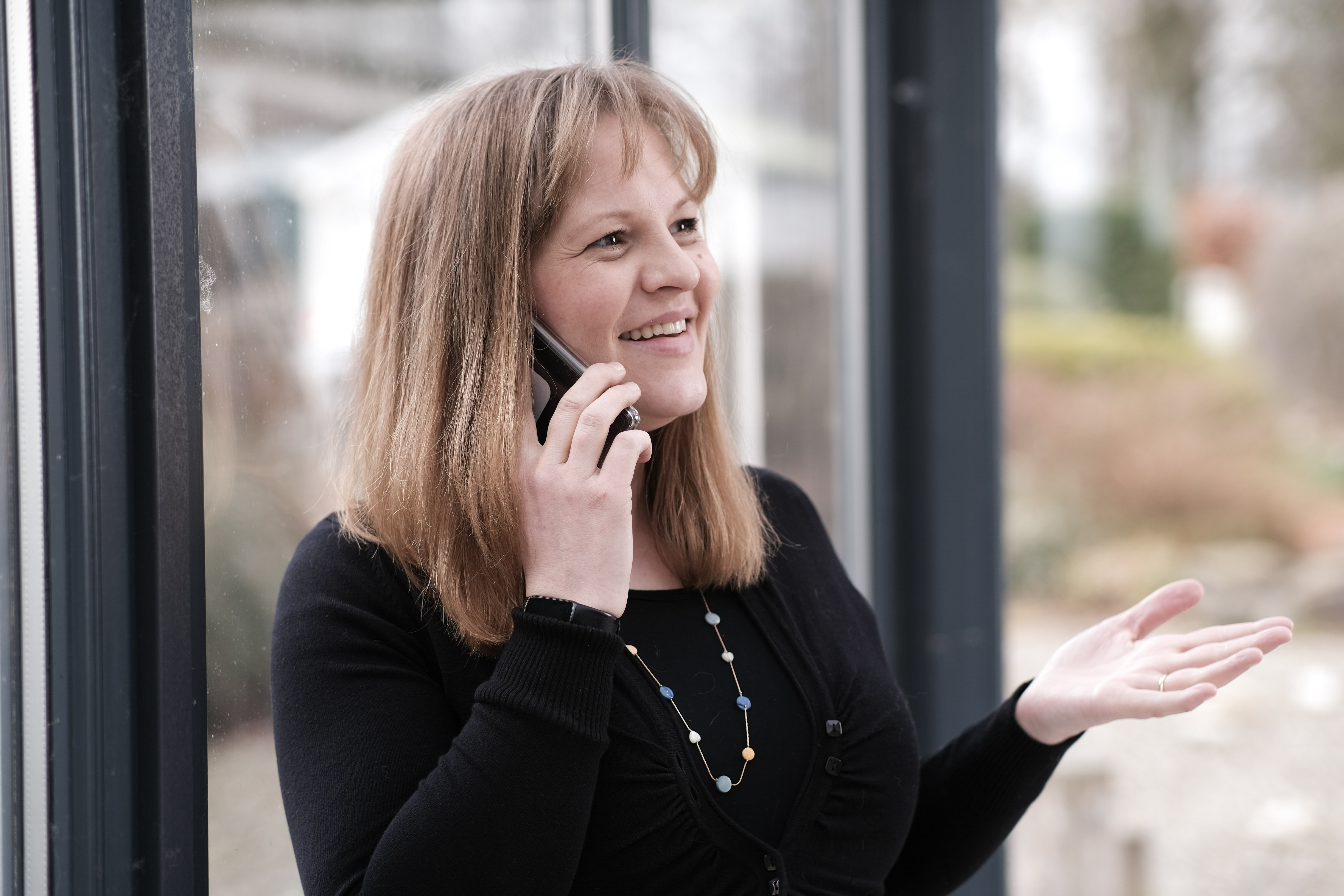 Rebecca Wilson on the phone explaining something