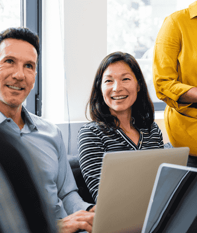Woman smiling in team meeting
