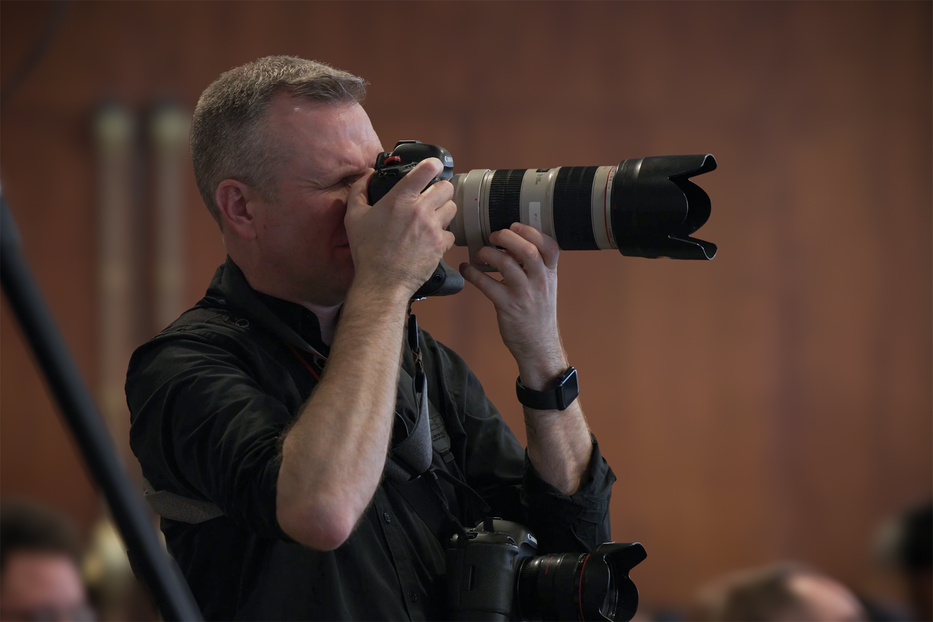 Tim Fraser in the middle of taking a photograph.