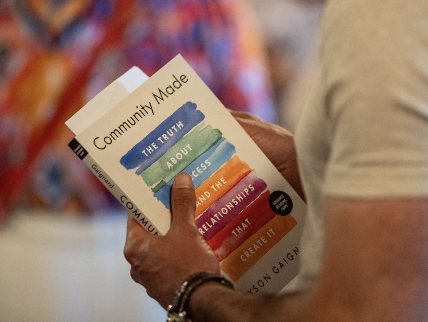 Jayson Gaignard holding a copy of Community Made