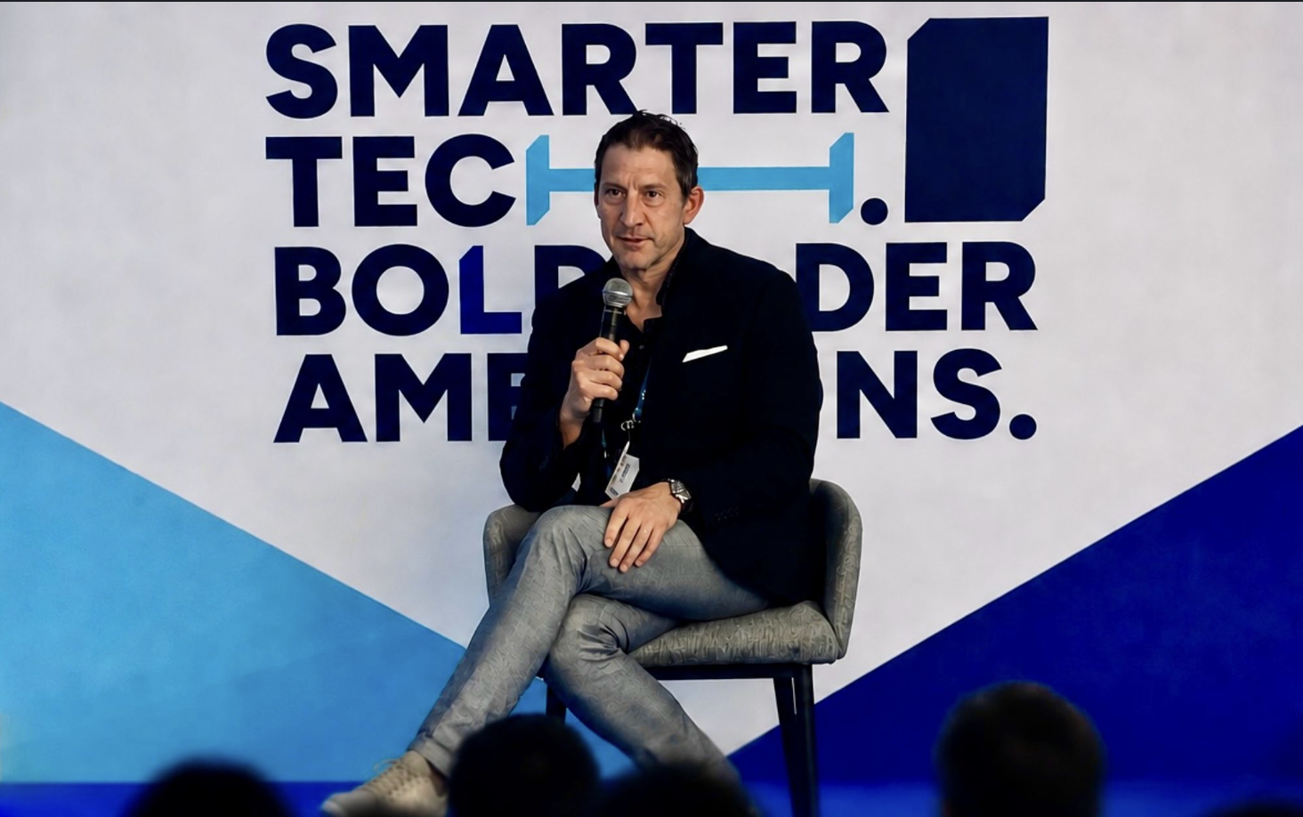 Craig Gauthier speaking on stage at an event