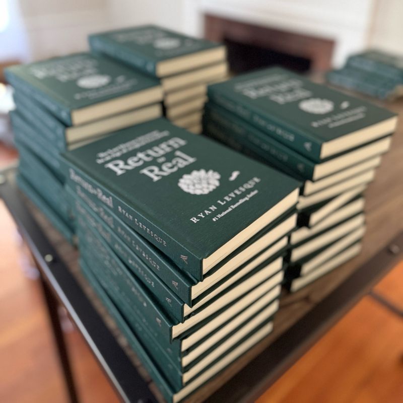 Stacks of finished hardcovers ready for signing