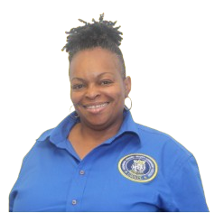 Ms. Weir, staff member smiling in blue uniform shirt