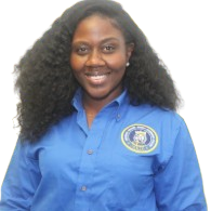 Ms. Milord smiling in blue school staff uniform
