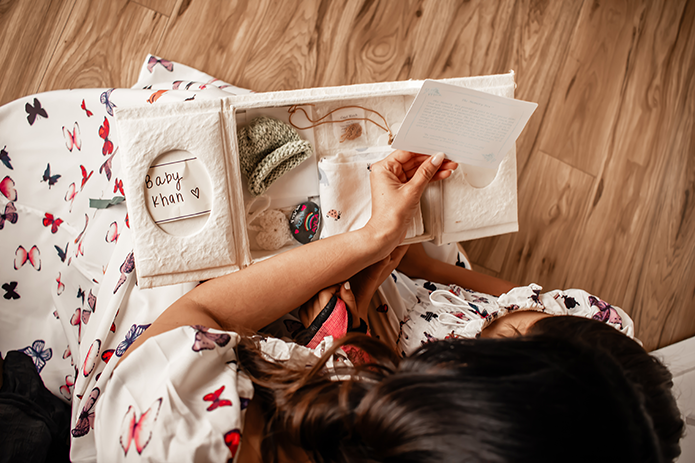 Mother and child holding keepsake box of a passed loved one - Light of Grief support for grief in Orange County California