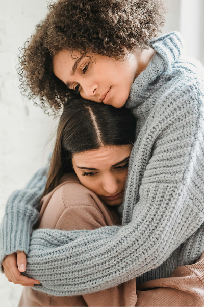 Two women hugging