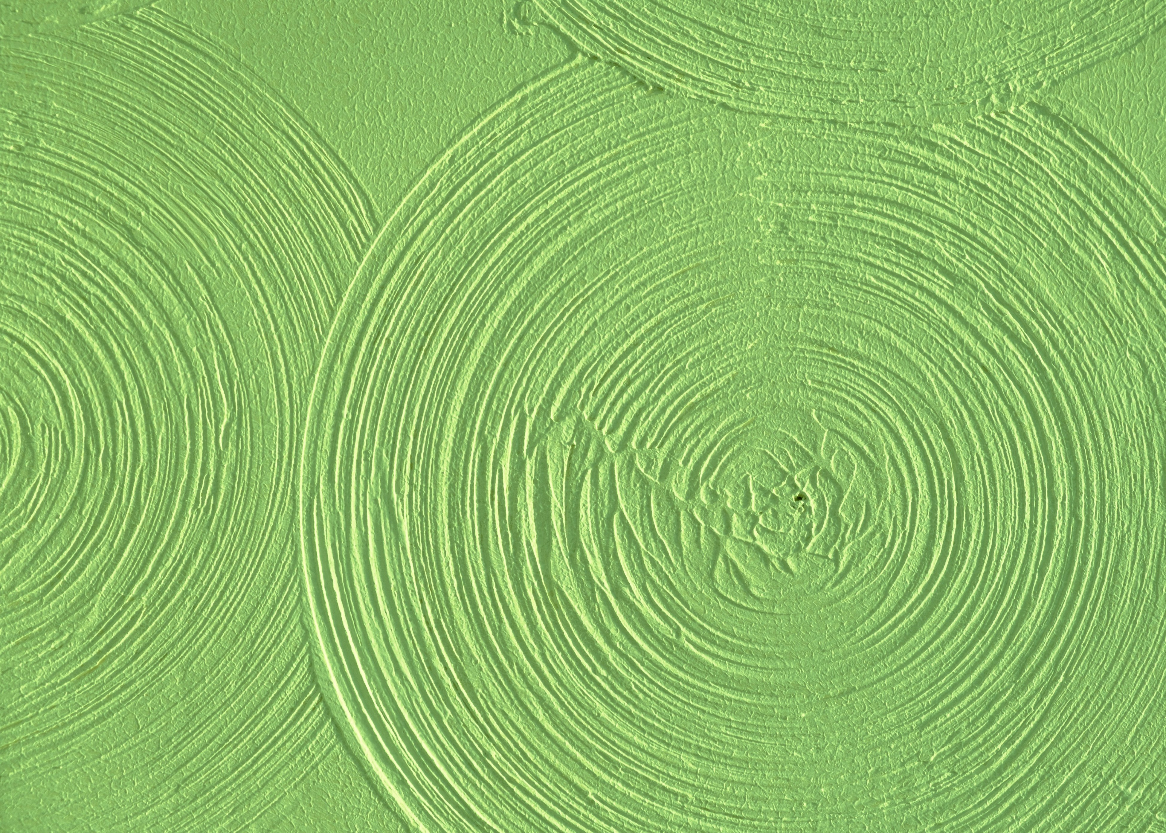A close up of a green background with circles.