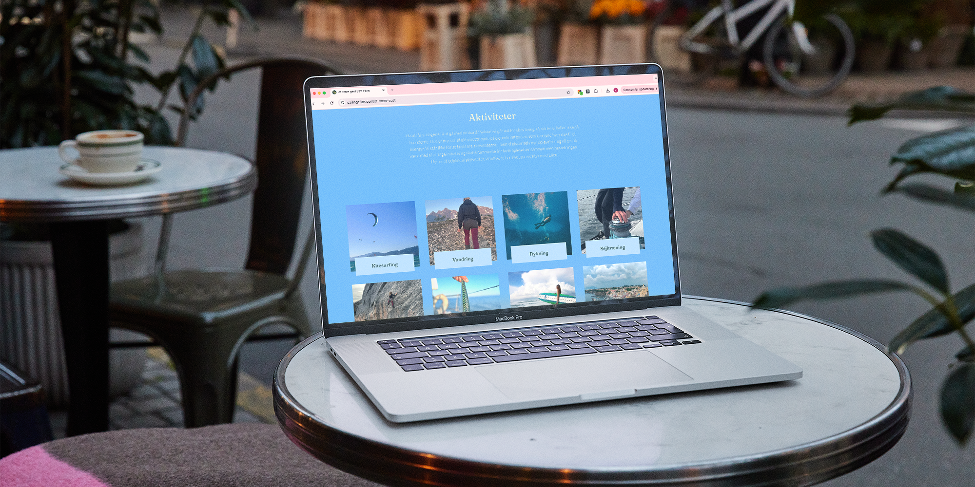 Sailing ellen website on laptop on cafe table 