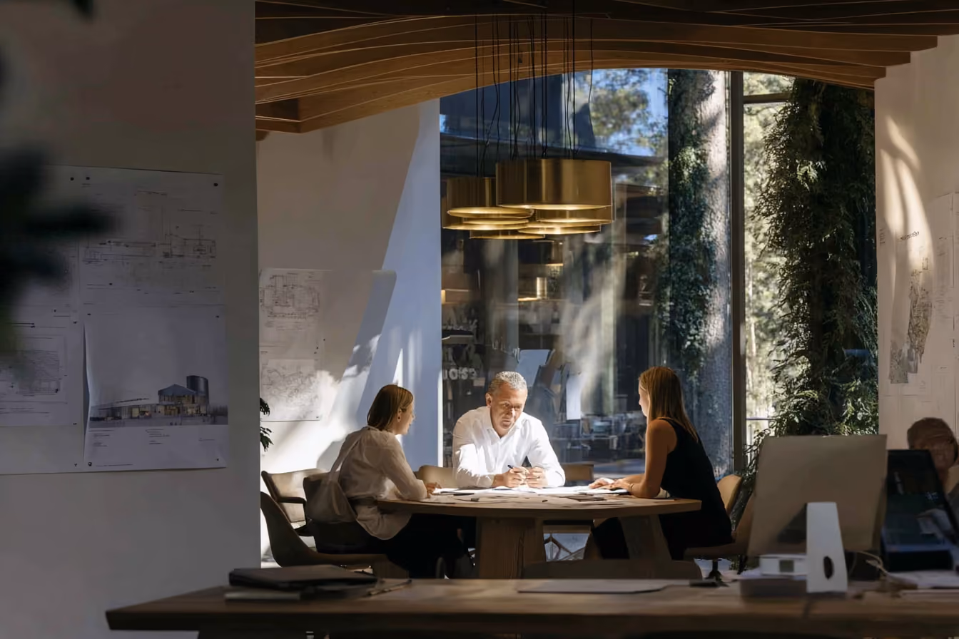 People in office with greenery wall