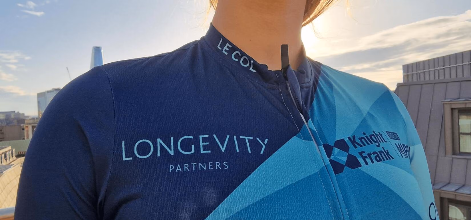 Team member wearing Longevity branded cycling jersey