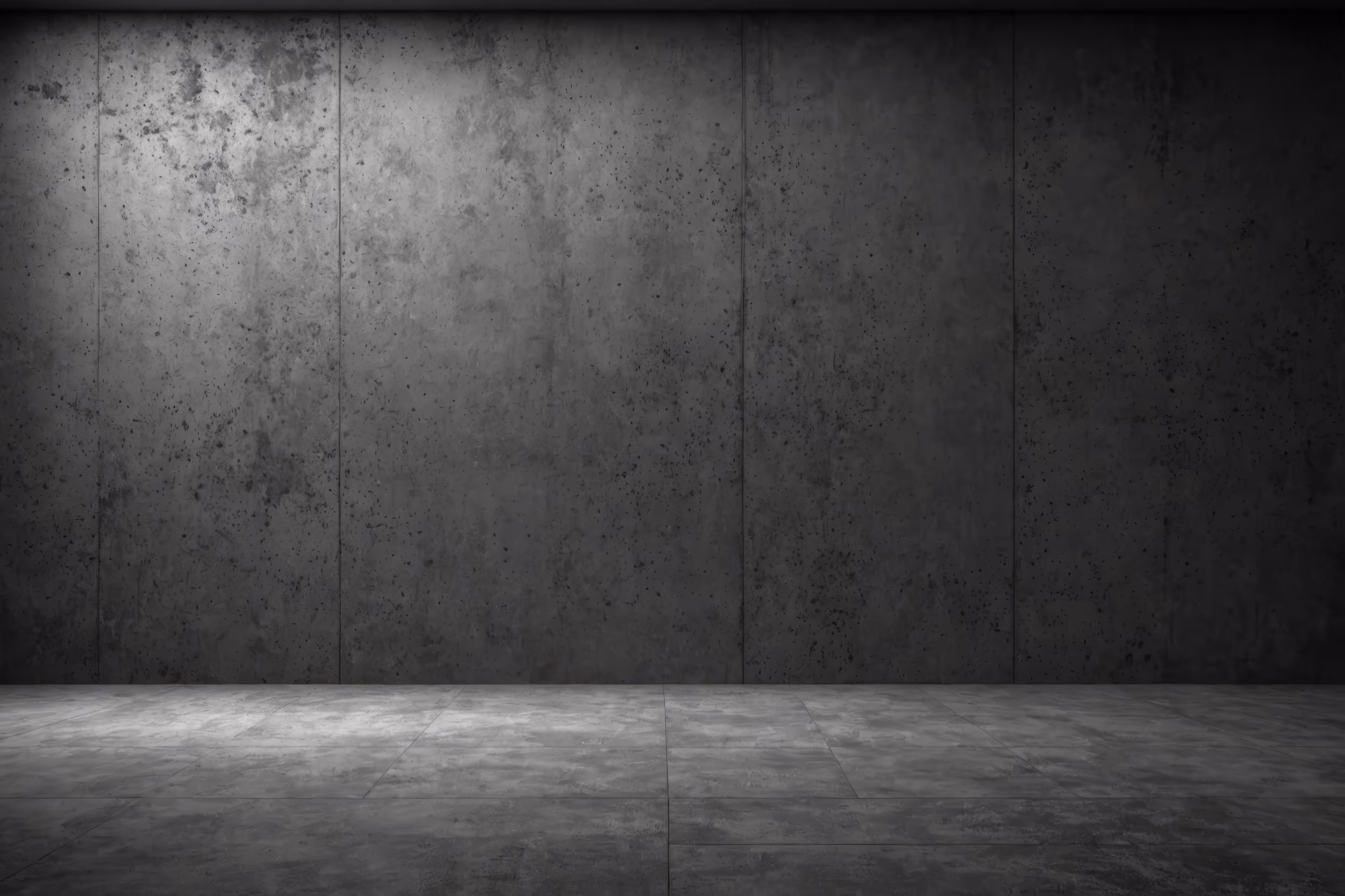 Dimly lit concrete wall and floor with textured, grungy surface