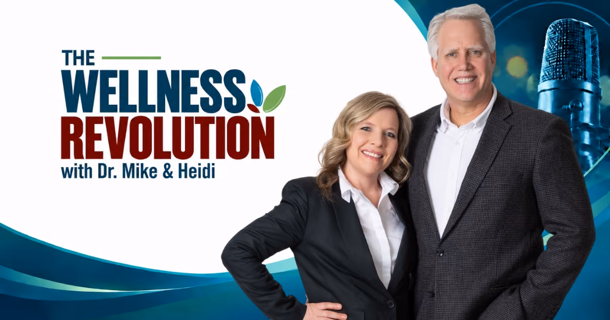 Dr. Mike and Heidi standing and smiling against a blue and white background with a large microphone image, alongside the text 'The Wellness Revolution with Dr. Mike & Heidi.'