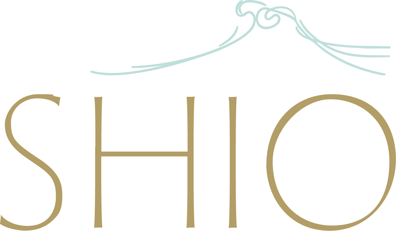 Logo with the word SHIO in large letters and a decorative wave-like swirl above the text.