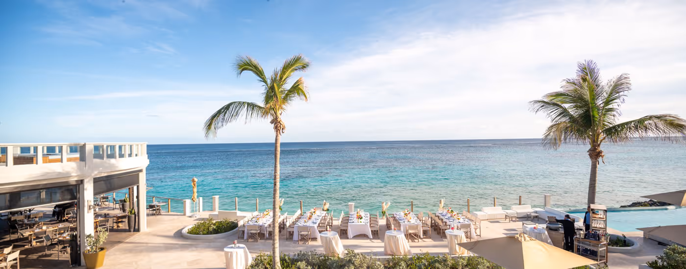 Tables set up for event by the ocean
