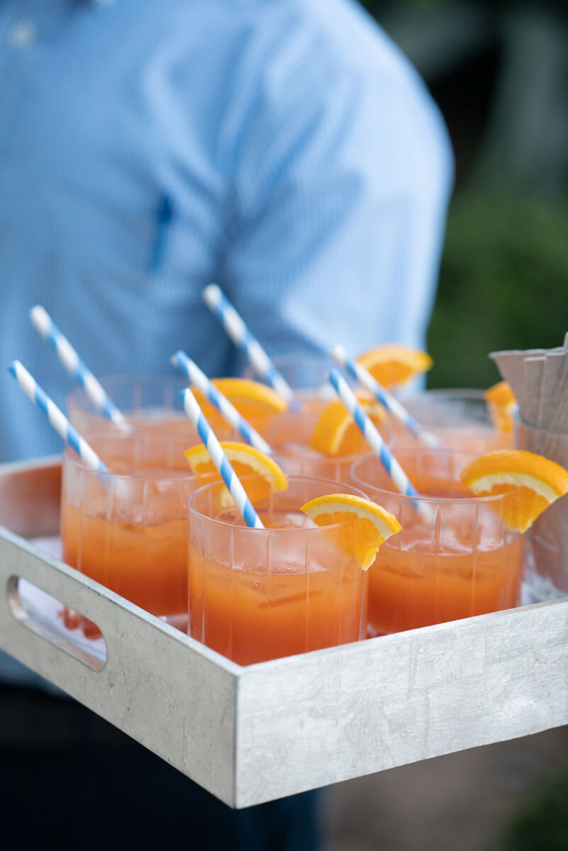 Close up of orange drinks with straws