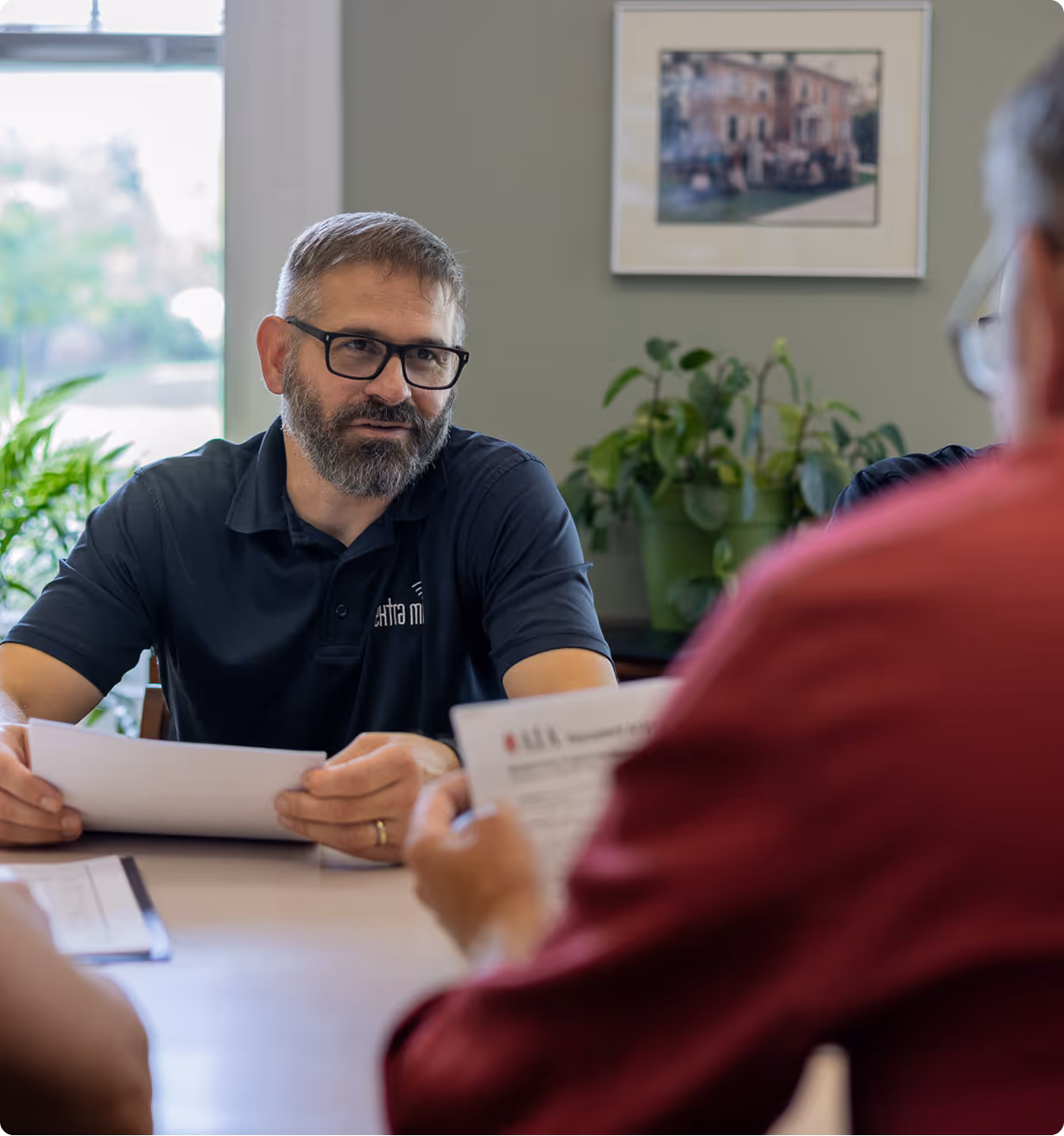 Owner Mike Davis speaking with IT customers in a consultation meeting