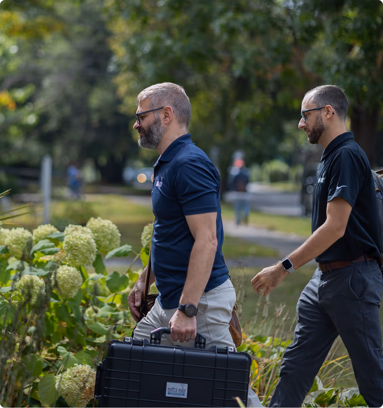 Owner Mike and technician Tom showing up for an onsite service call with tool cases