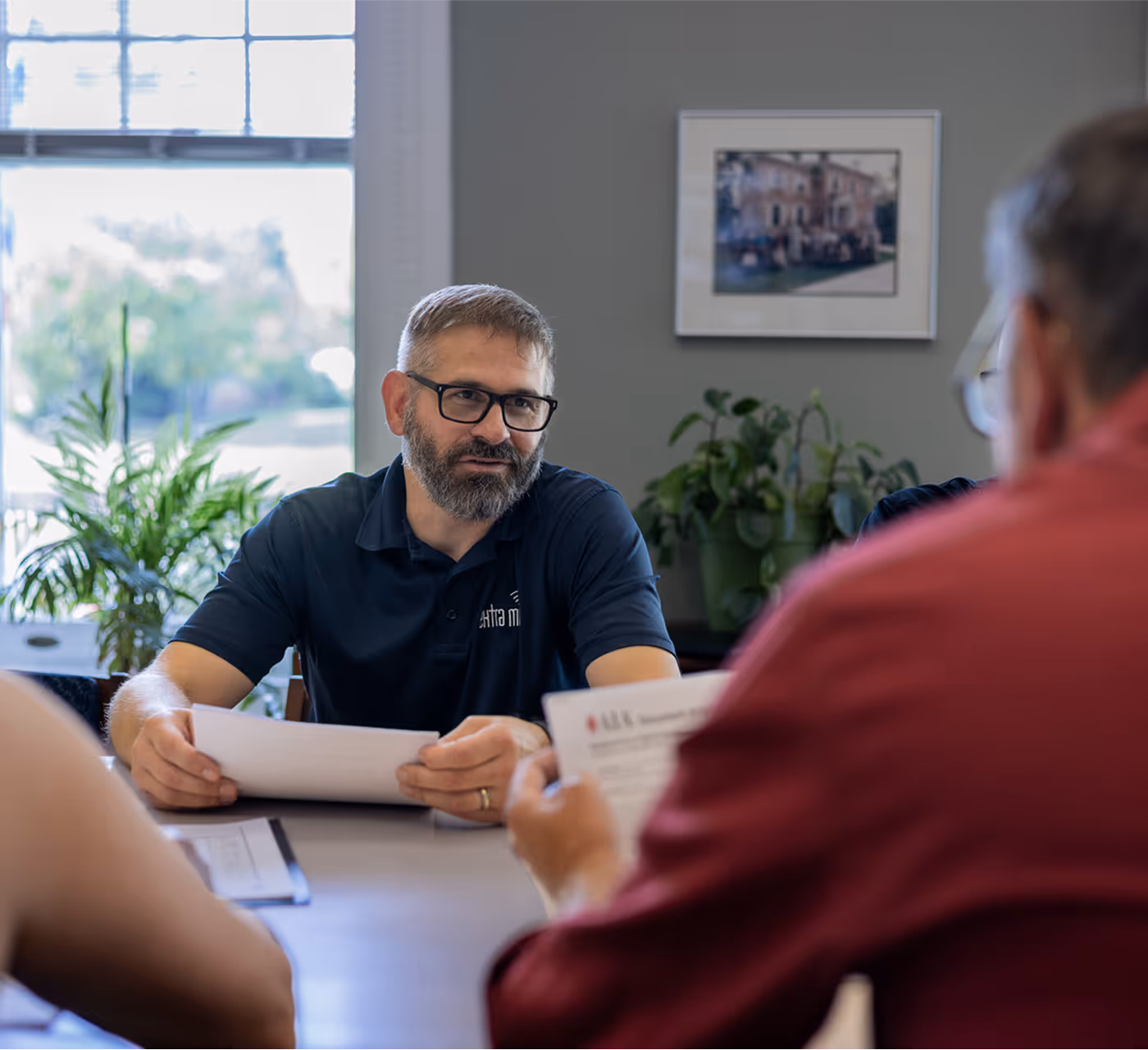 Owner Mike Davis speaking with IT customers in a consultation meeting