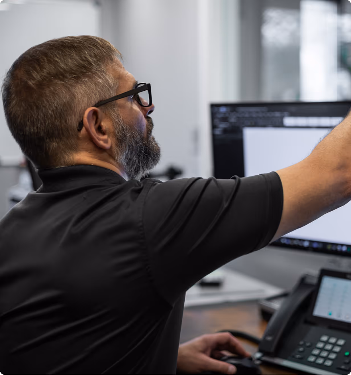 Owner Mike Davis adjusting the angle of his webcam before a call