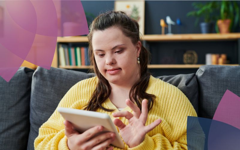 A participant relaxes on a couch, engaging with her tablet and enjoying her leisure time in a comfortable and supportive home environment.