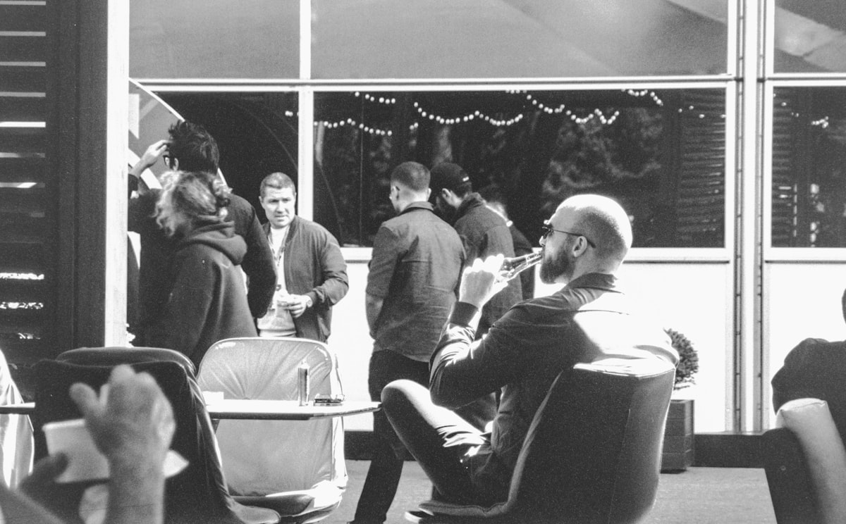 People having a casual conversation at an evening networking event