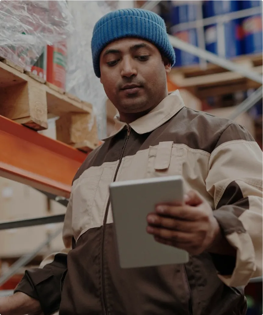 person with tablet with warehouse data