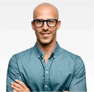 A man wearing glasses and a blue shirt.