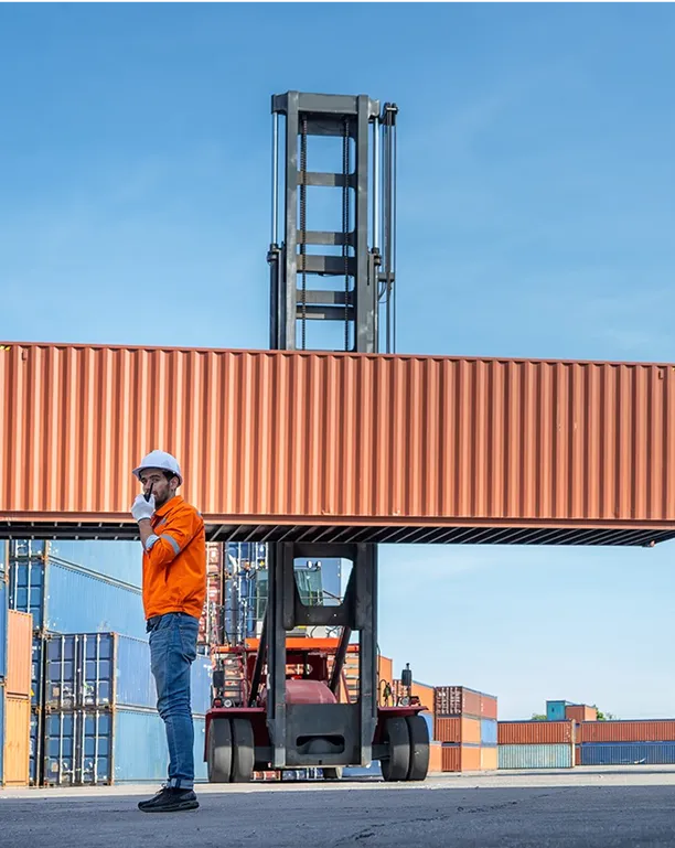 a man infront of a forklift