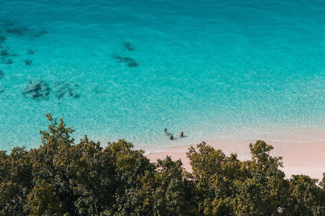 Relaxing in the turquoise shallows by the beach