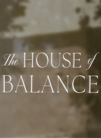 Text reading 'The House of Balance' over a blurred natural background.
