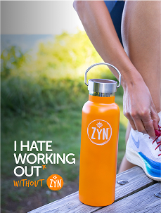 Person tying shoelaces next to an orange ZYN-branded water bottle on a wooden surface outdoors.