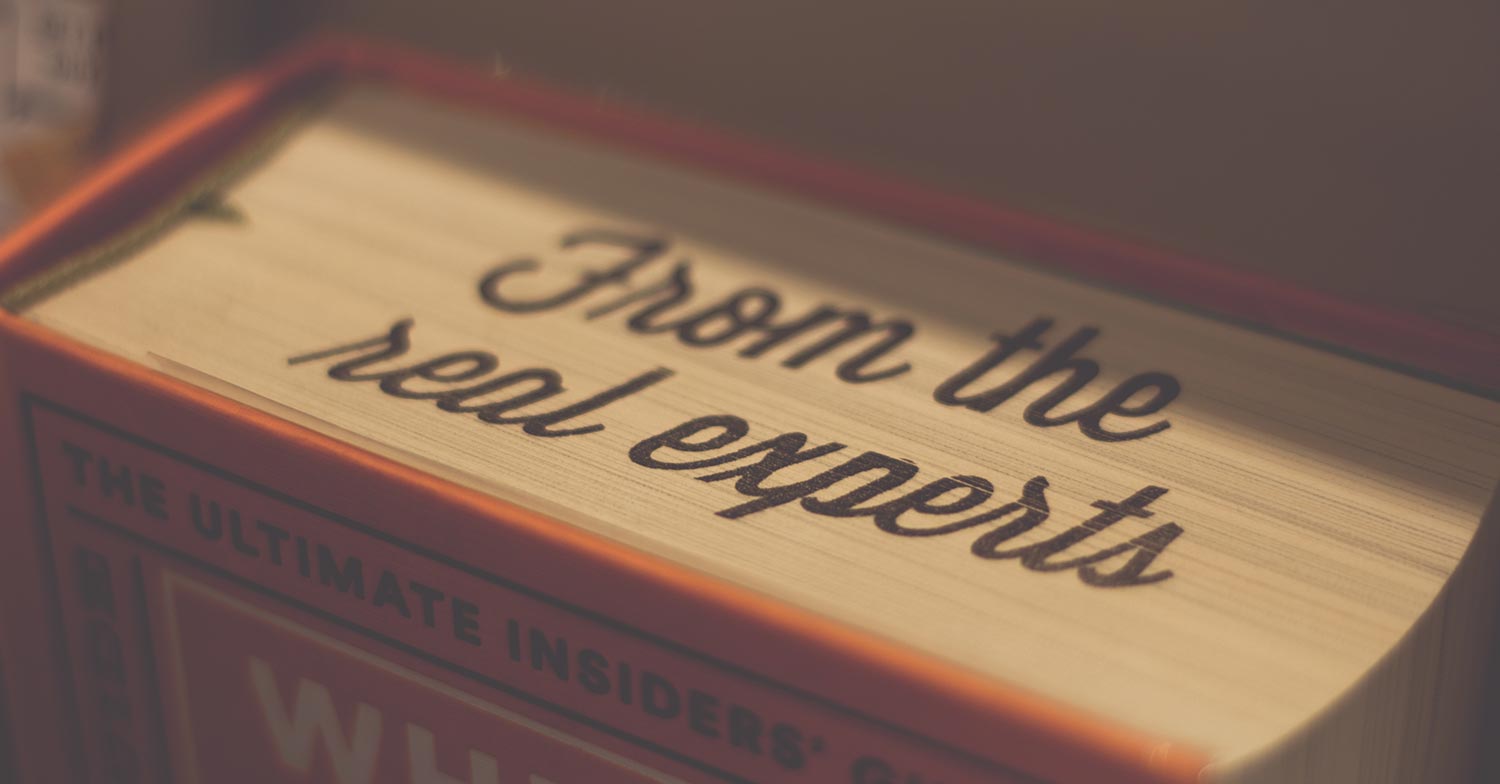 Book with writing on top "From the real experts"