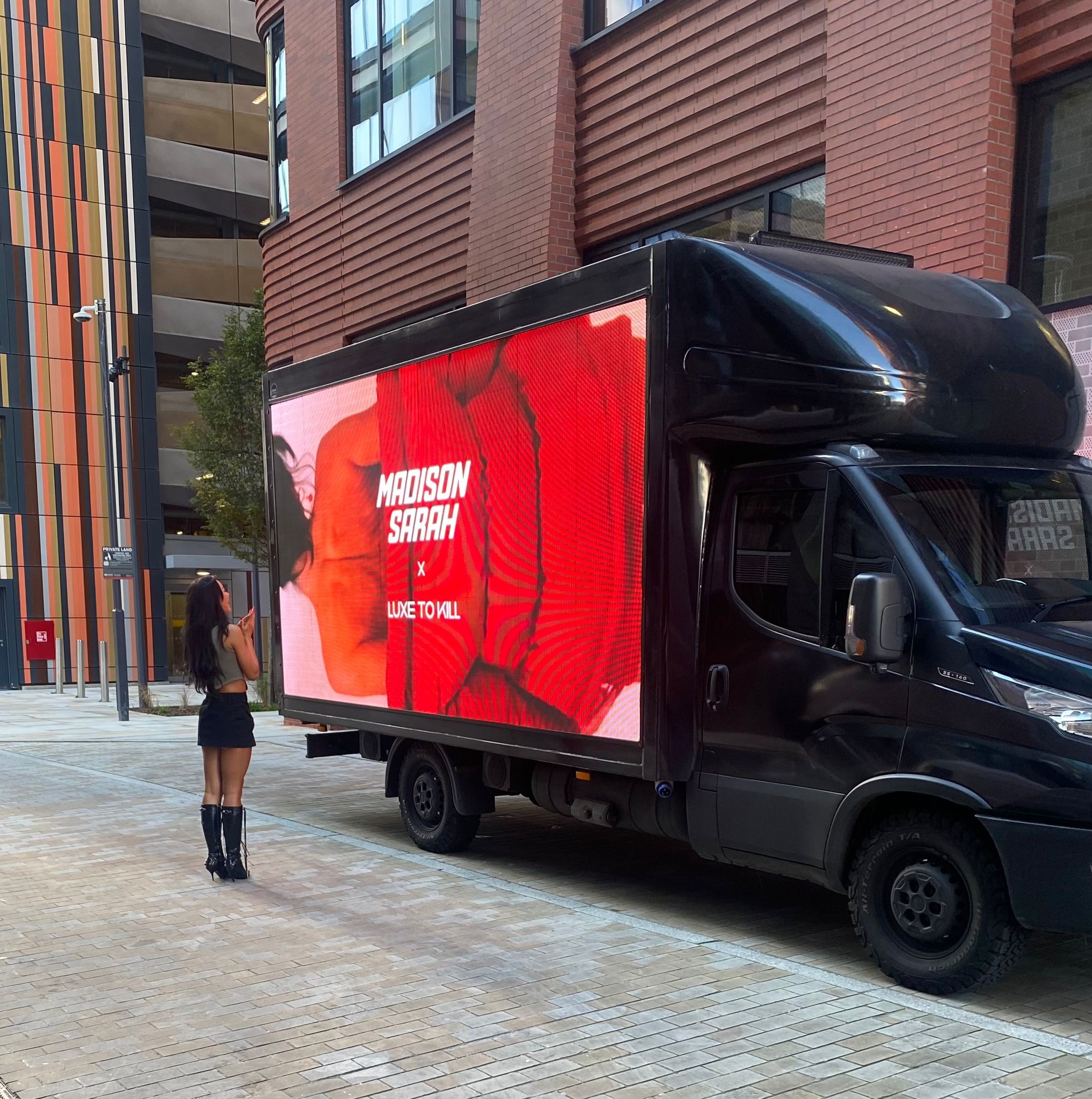 [background image] image of a digital display screen with marketing visuals (for a ai marketing tech company)