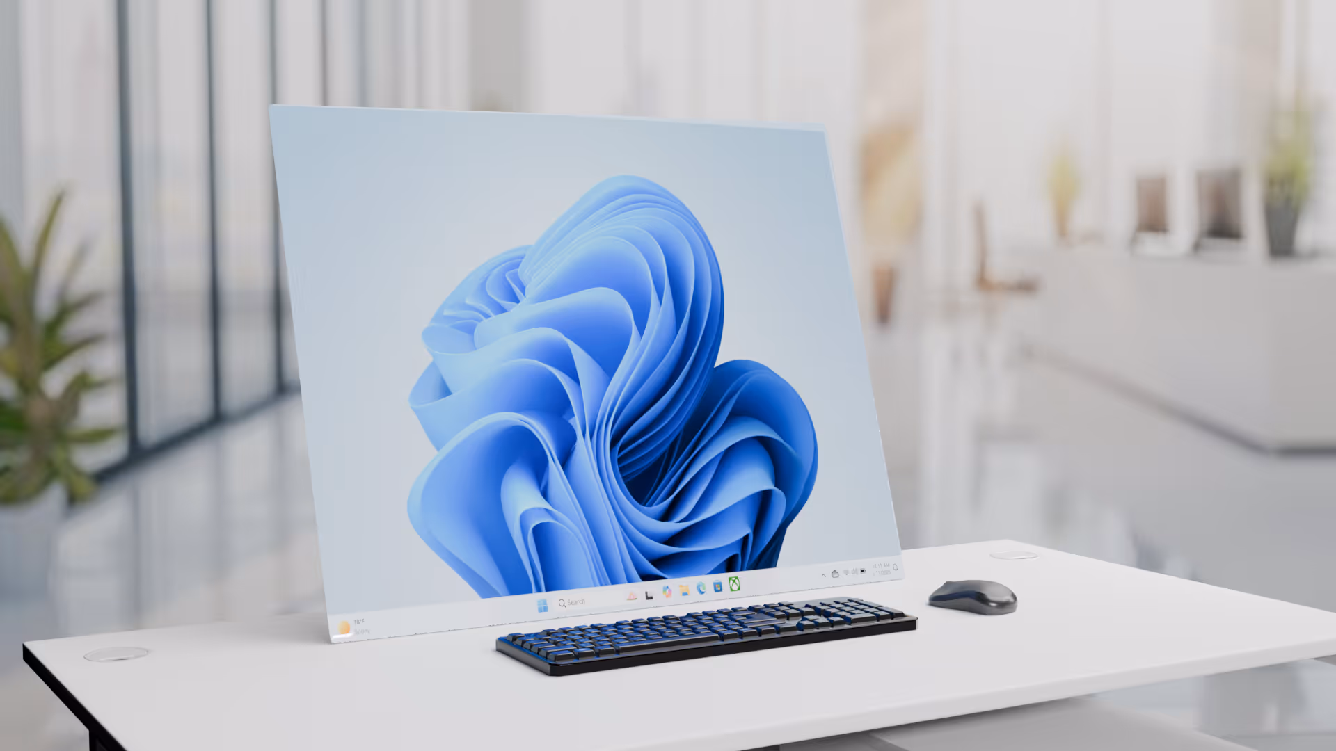 Black wireless keyboard and mouse on a white office desk with Full-extend Rollable screen in the office desk in a bright modern workspace.
