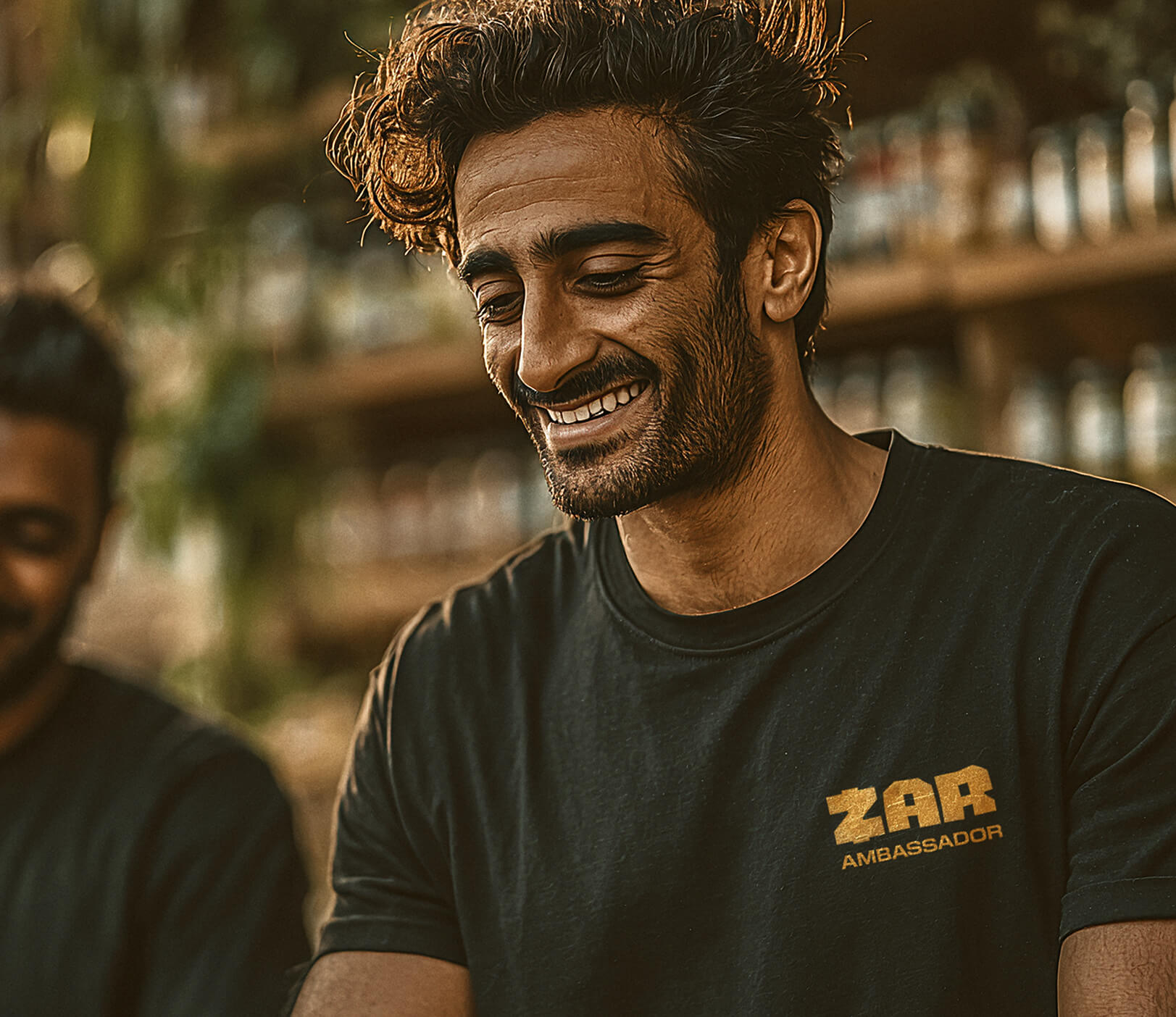 a man wearing a Zar shirt