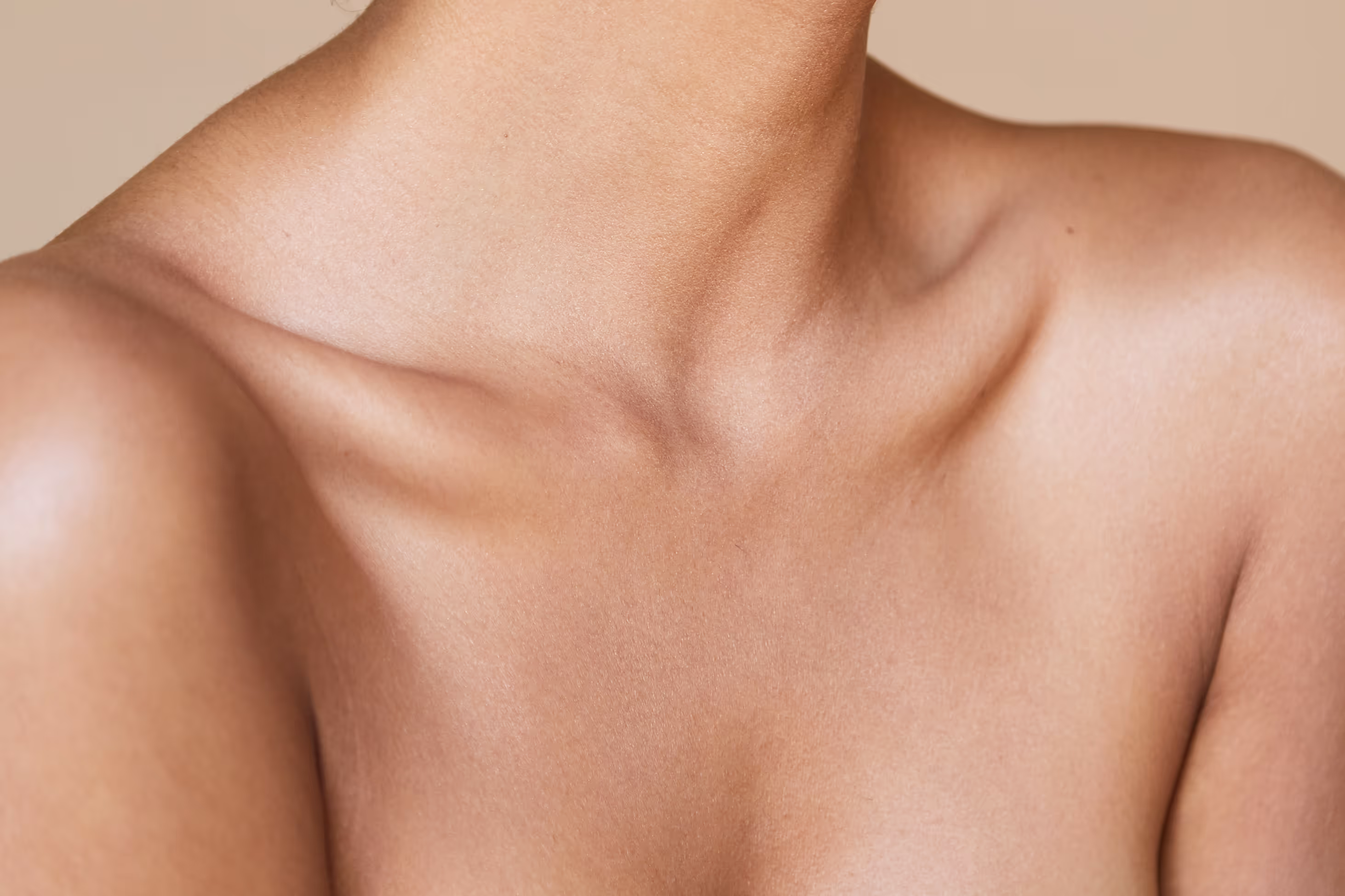 Torso of a woman with vibrant, youthful skin and smooth texture.