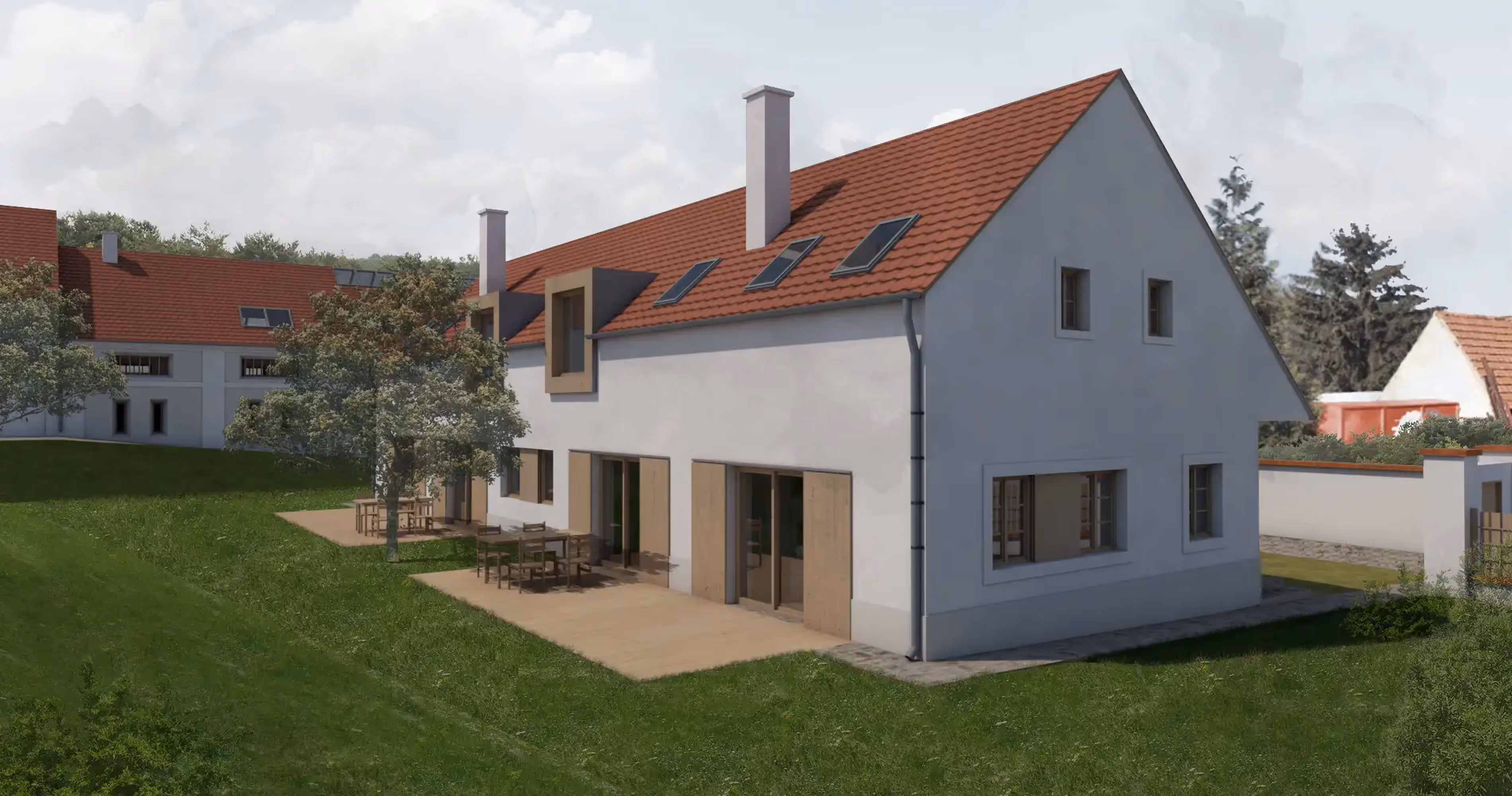 Modern two-story house with white walls, red tiled roof, skylights, and outdoor patio tables on a green lawn.