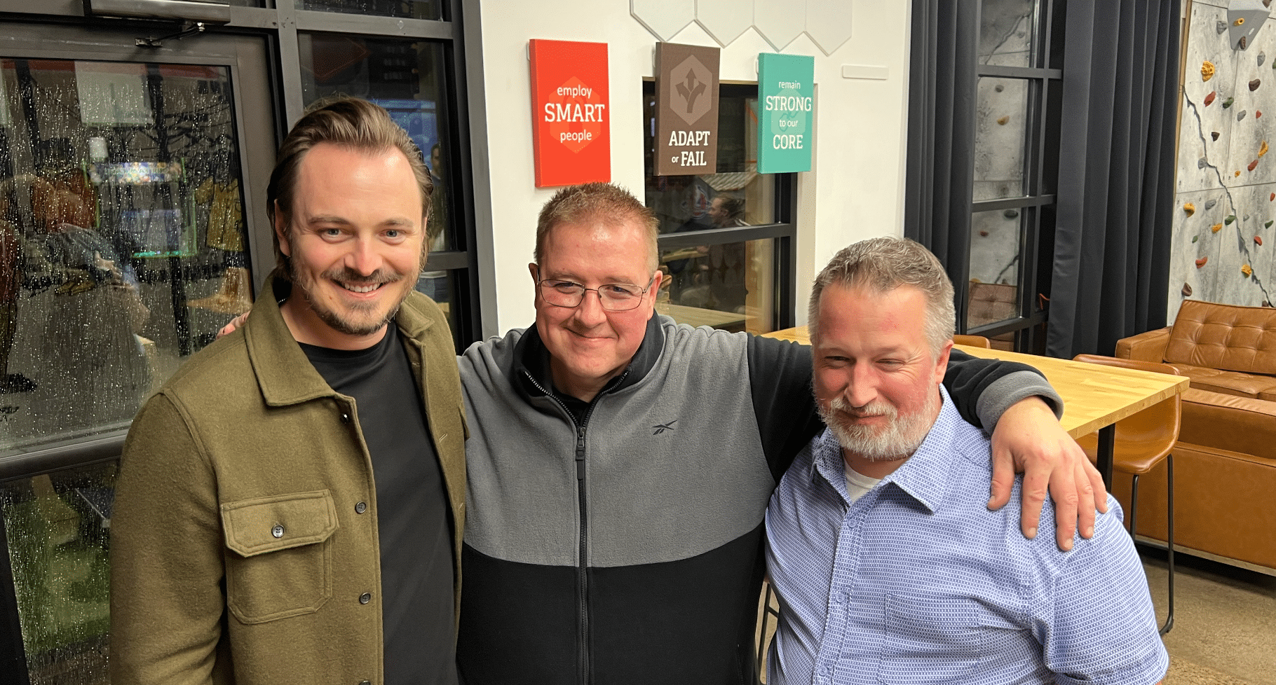 Jason, Virgil, and Chad smiling at the camera
