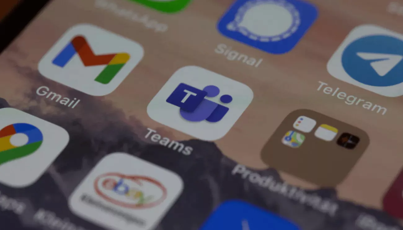 A smartphone screen displaying Microsoft Teams and other app icons.