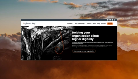 Screenshot of the new HIgh Monkey homepage pasted on top of a cloudy mountain background 