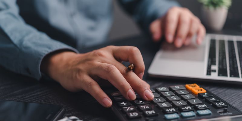 Person budgeting using calculator