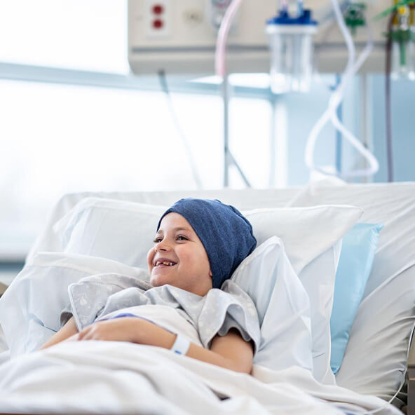 Young girl holding a newborn baby, symbolizing patient care and future outcomes