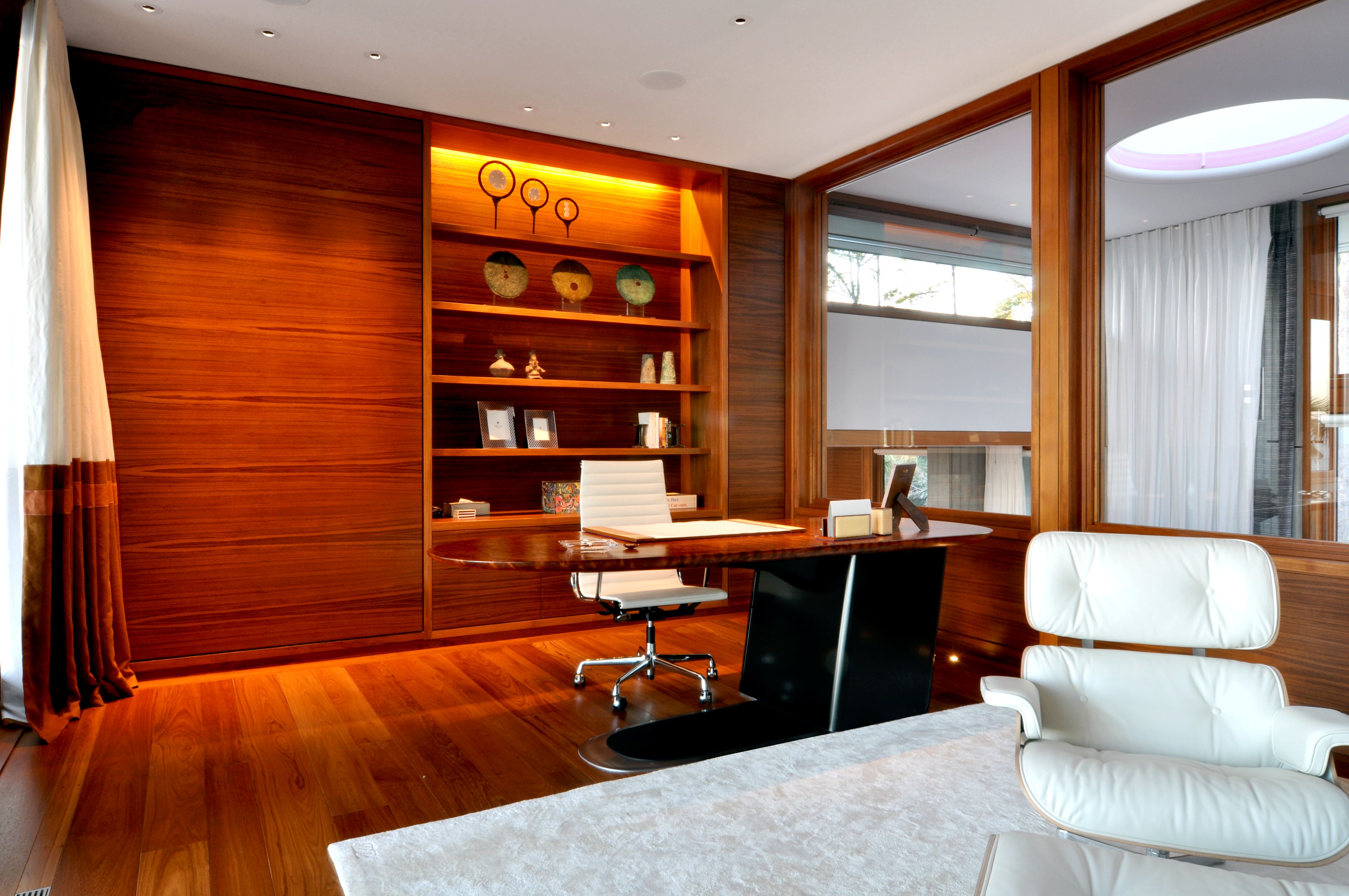 Office with skylight tube in stair hall