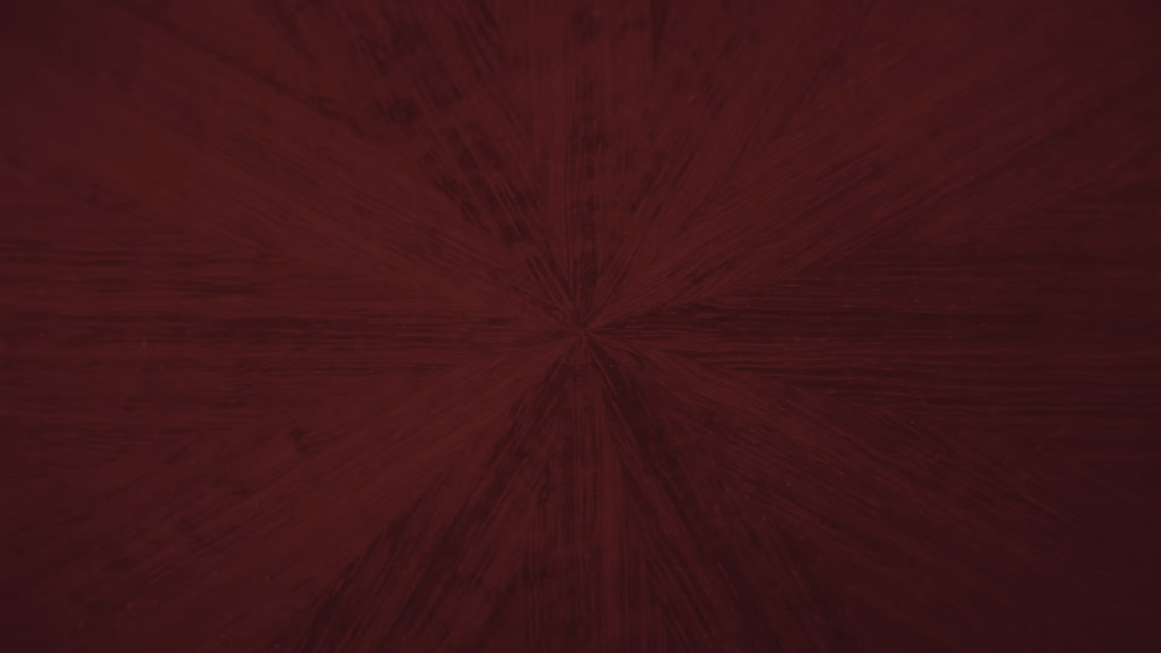 A red background with a dark brown circle in the center.