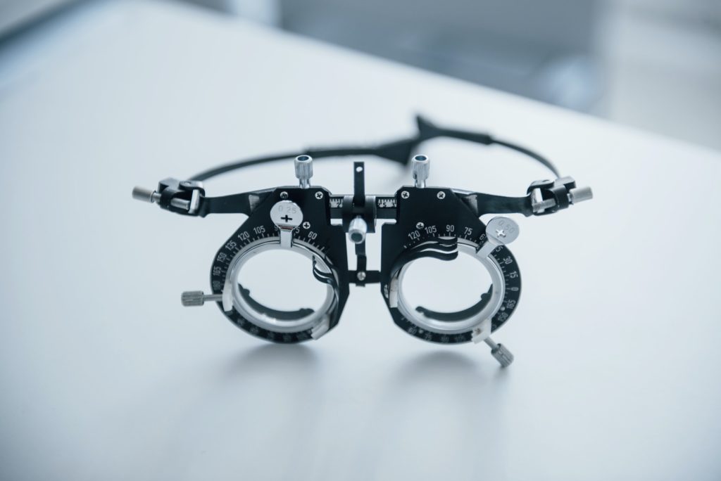 Diopter is on the white table. Close up view of single object